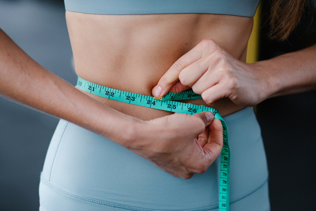 Woman Measuring her Abdo